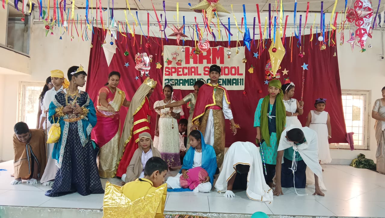 KRM Special School students performing a costumed Christmas drama on stage
