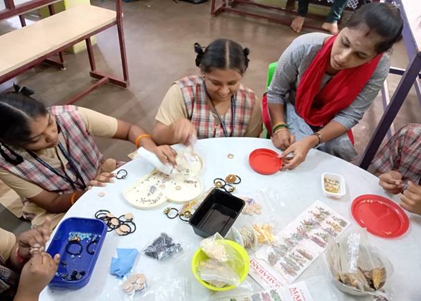 Students engaged in a hands-on vocational activity around a table